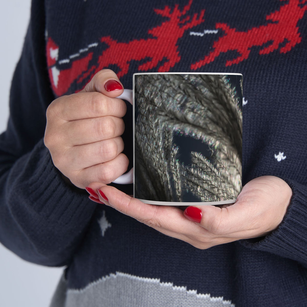 Ceramic mug with feather silhouette and soft neutral botanical design, available in 11oz and 15oz sizes. Printify brand.