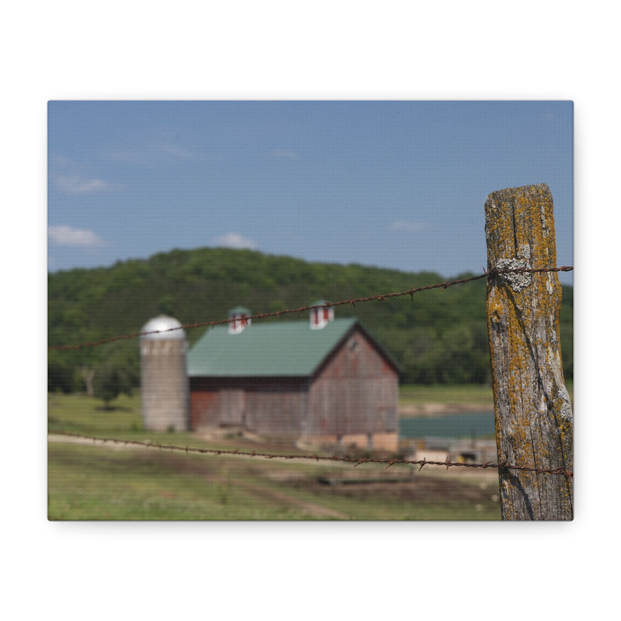 Rustic Barn Matte Stretched Canvas — Blurred Farm Landscape with Barbed Wire