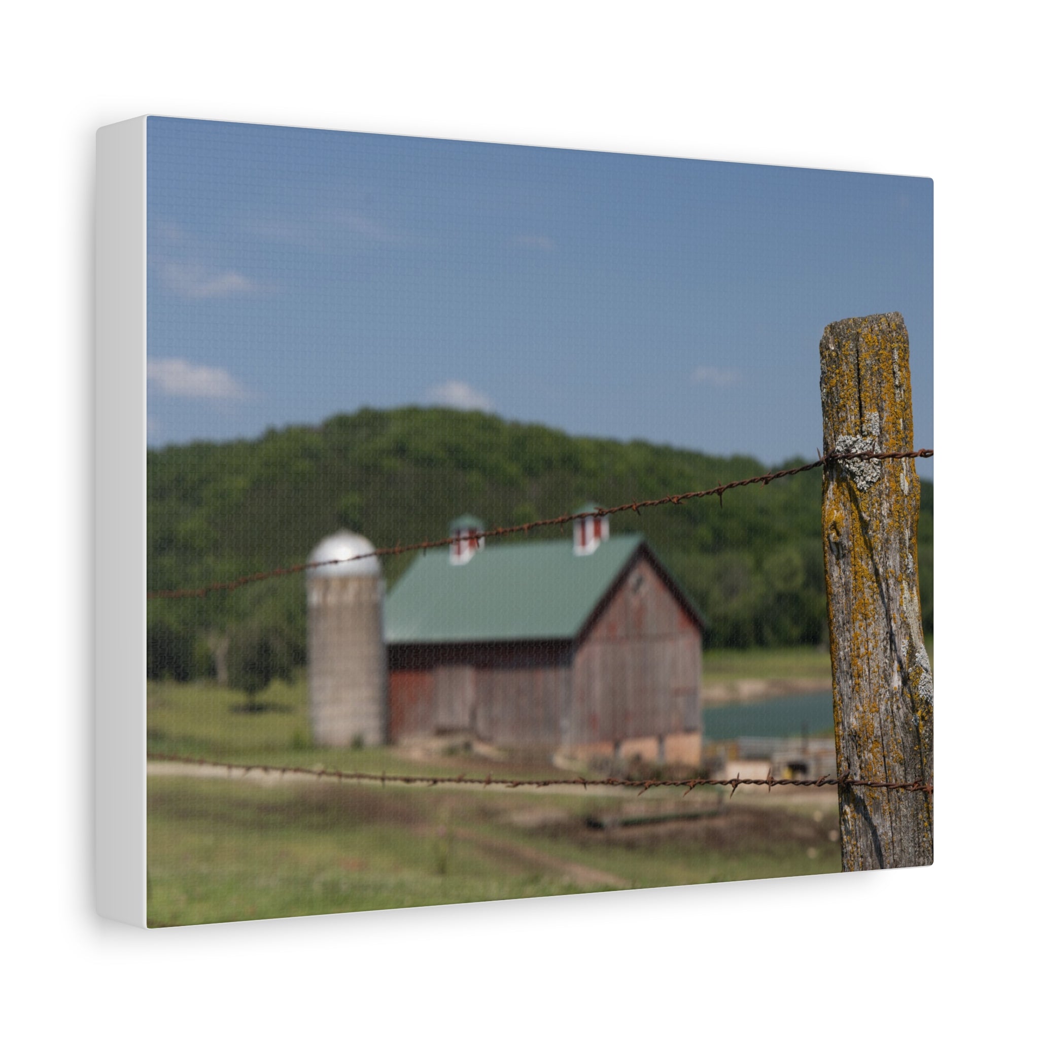Rustic Barn Matte Stretched Canvas — Blurred Farm Landscape with Barbed Wire