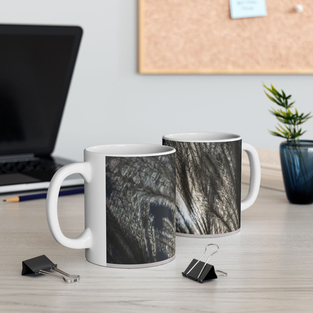 Ceramic mug with feather silhouette and soft neutral botanical design, 11oz or 15oz coffee cup by Printify.