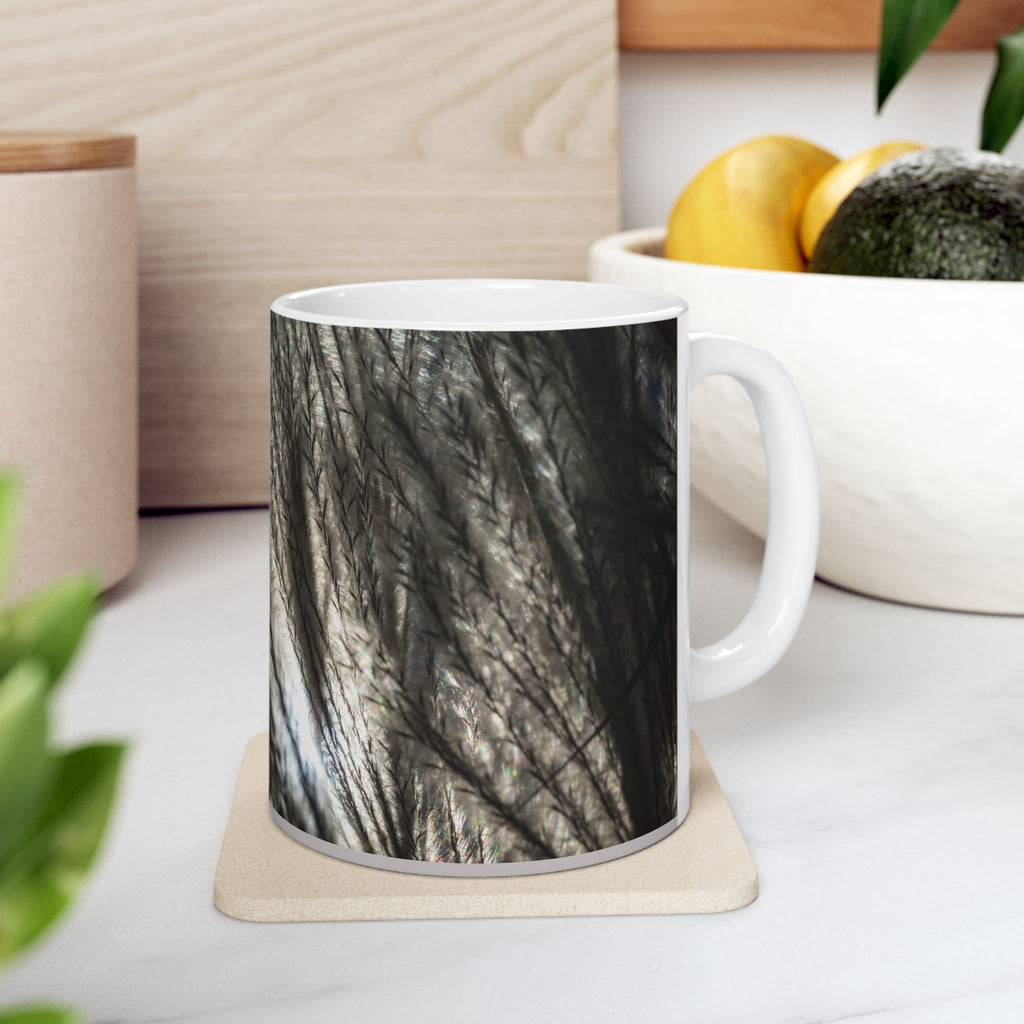 Ceramic mug with feather silhouette and soft neutral botanical design, available in 11oz and 15oz sizes, by Printify.