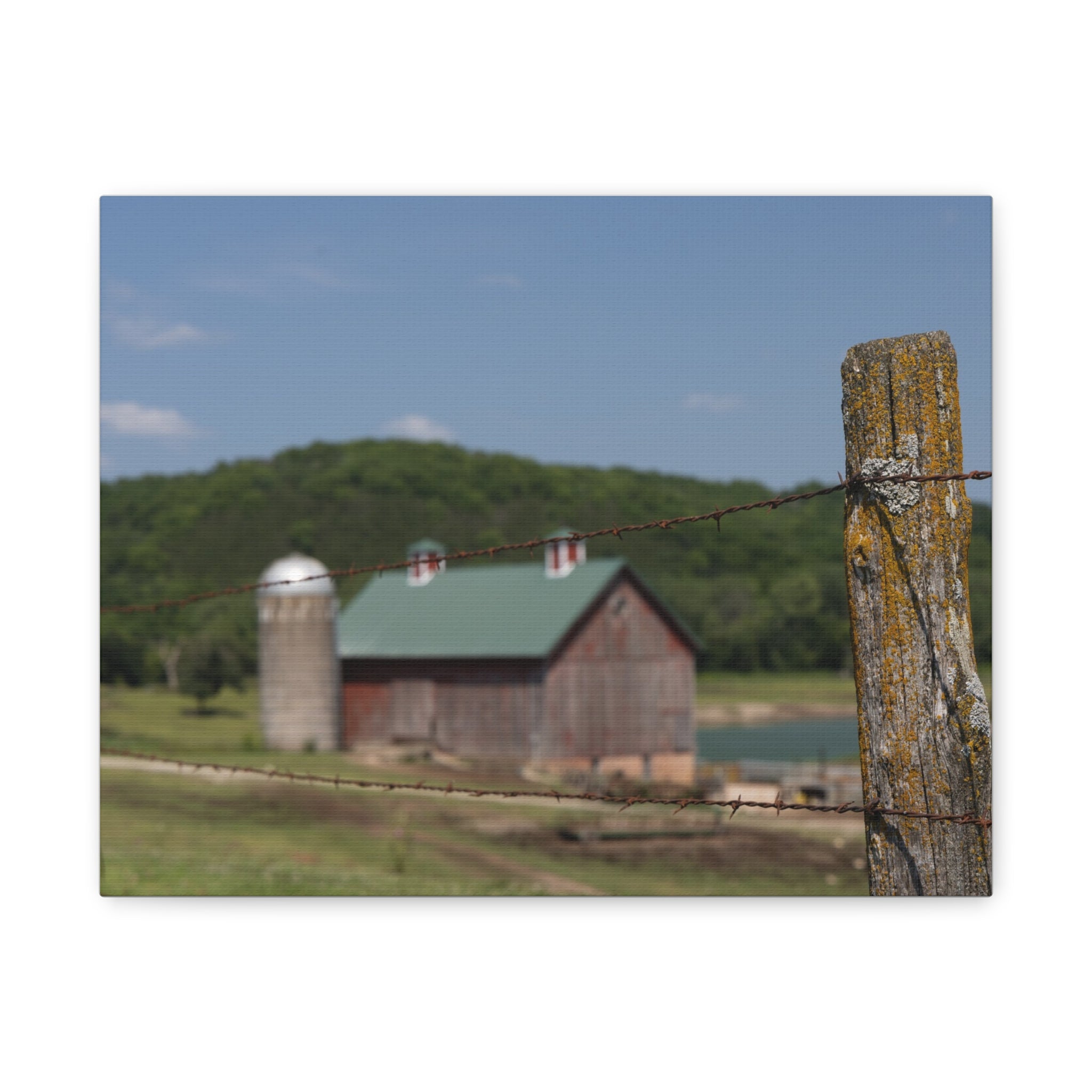 Rustic Barn Matte Stretched Canvas — Blurred Farm Landscape with Barbed Wire