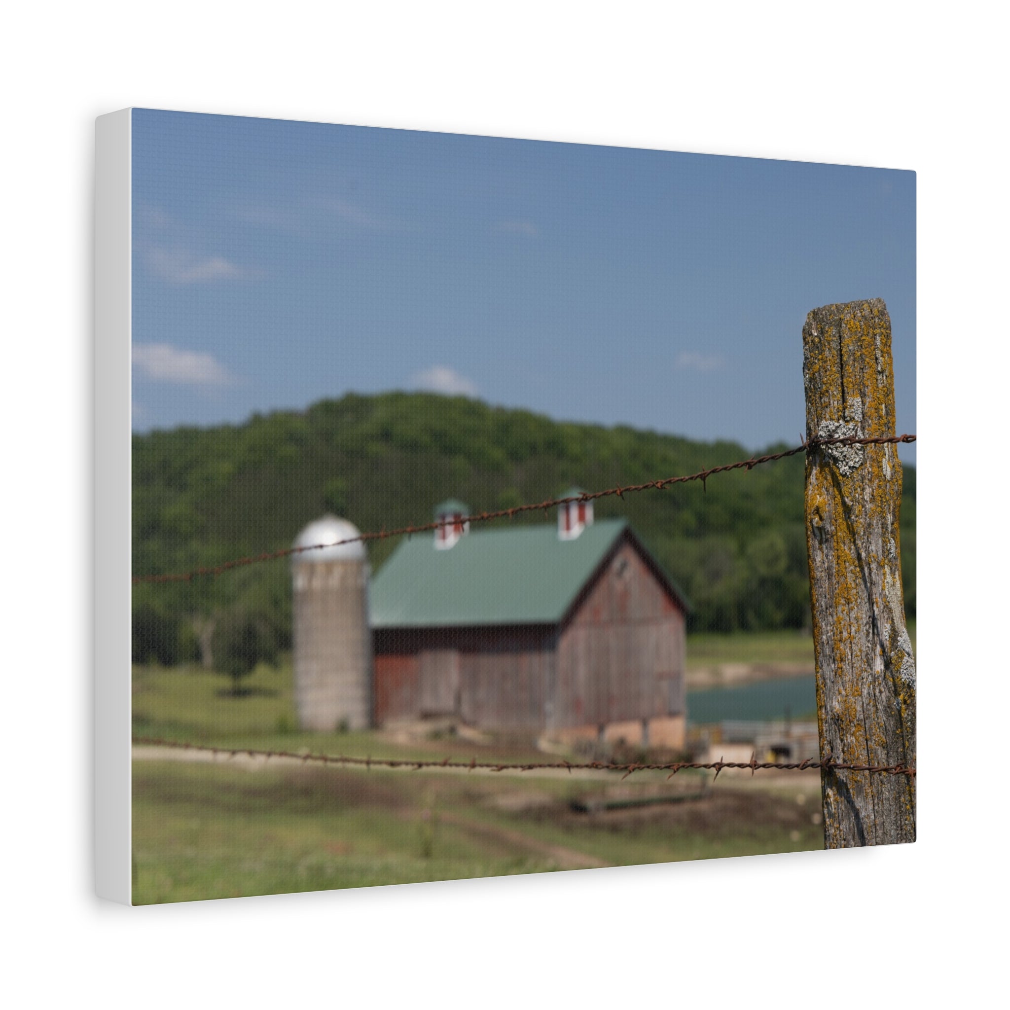 Rustic Barn Matte Stretched Canvas — Blurred Farm Landscape with Barbed Wire