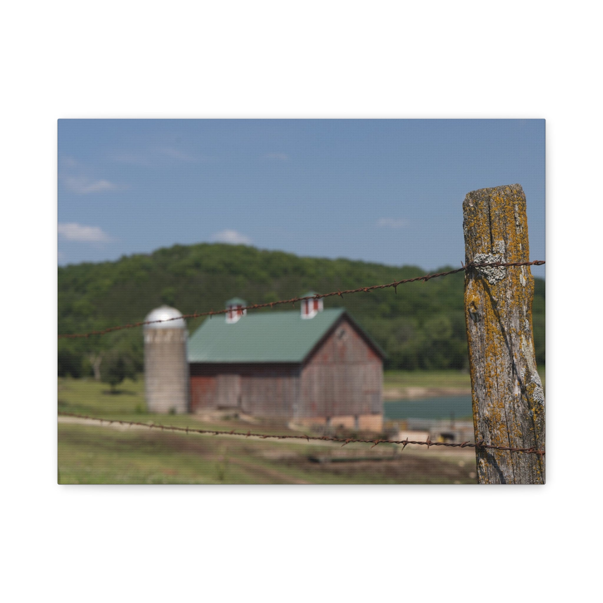 Rustic Barn Matte Stretched Canvas — Blurred Farm Landscape with Barbed Wire