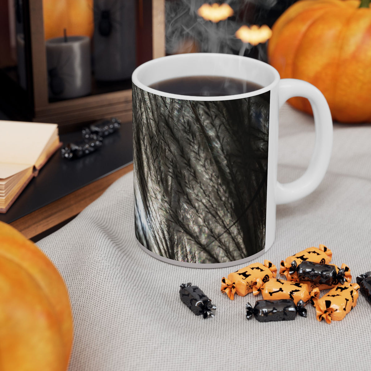 Ceramic mug with feather silhouette and soft neutral botanical design, available in 11oz and 15oz sizes, by Printify.