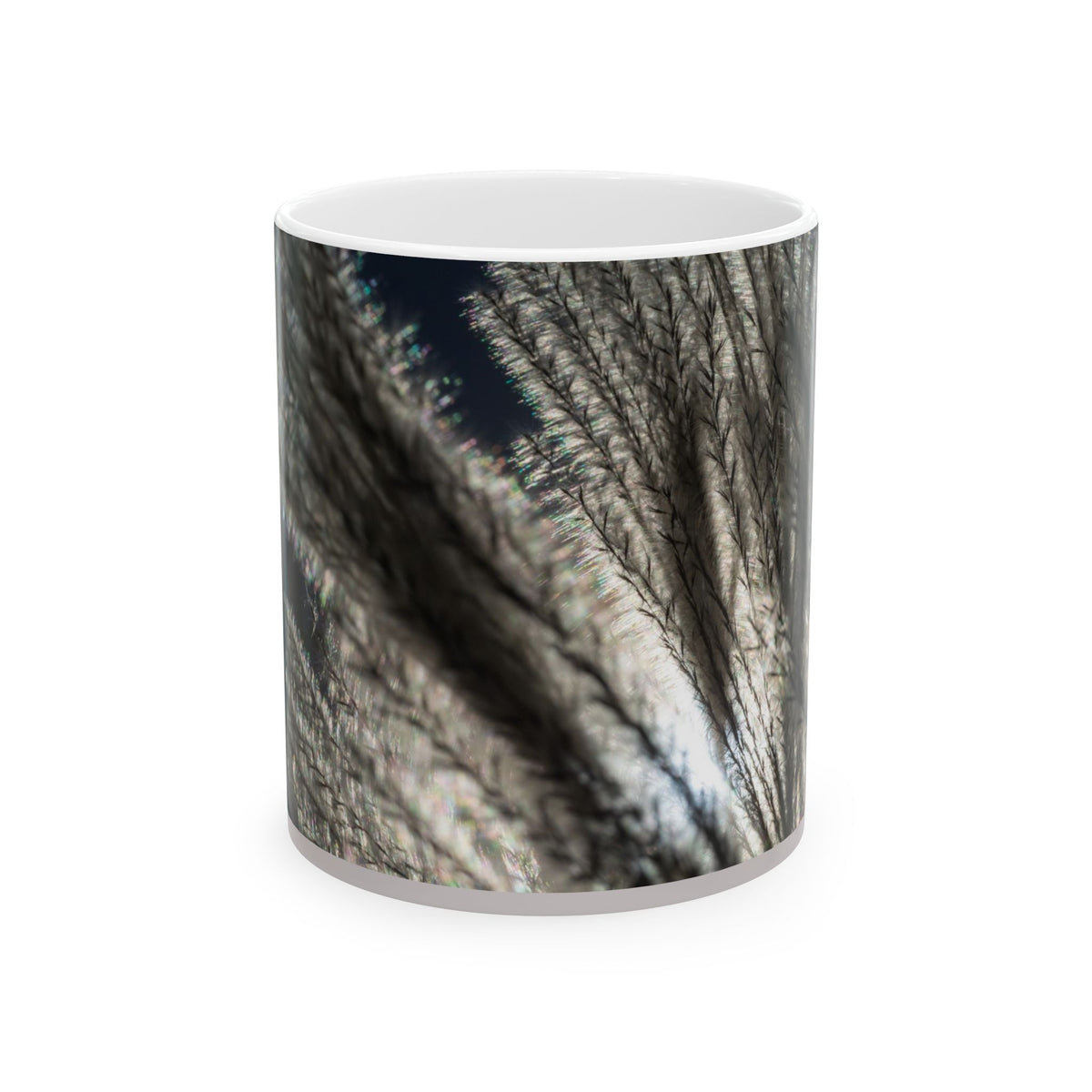 Ceramic mug with feather silhouette and soft neutral botanical design, available in 11oz and 15oz sizes.