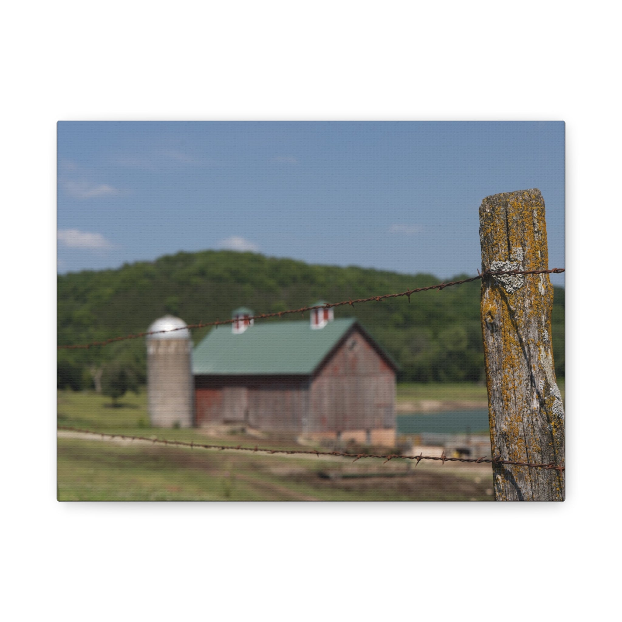 Rustic Barn Matte Stretched Canvas — Blurred Farm Landscape with Barbed Wire