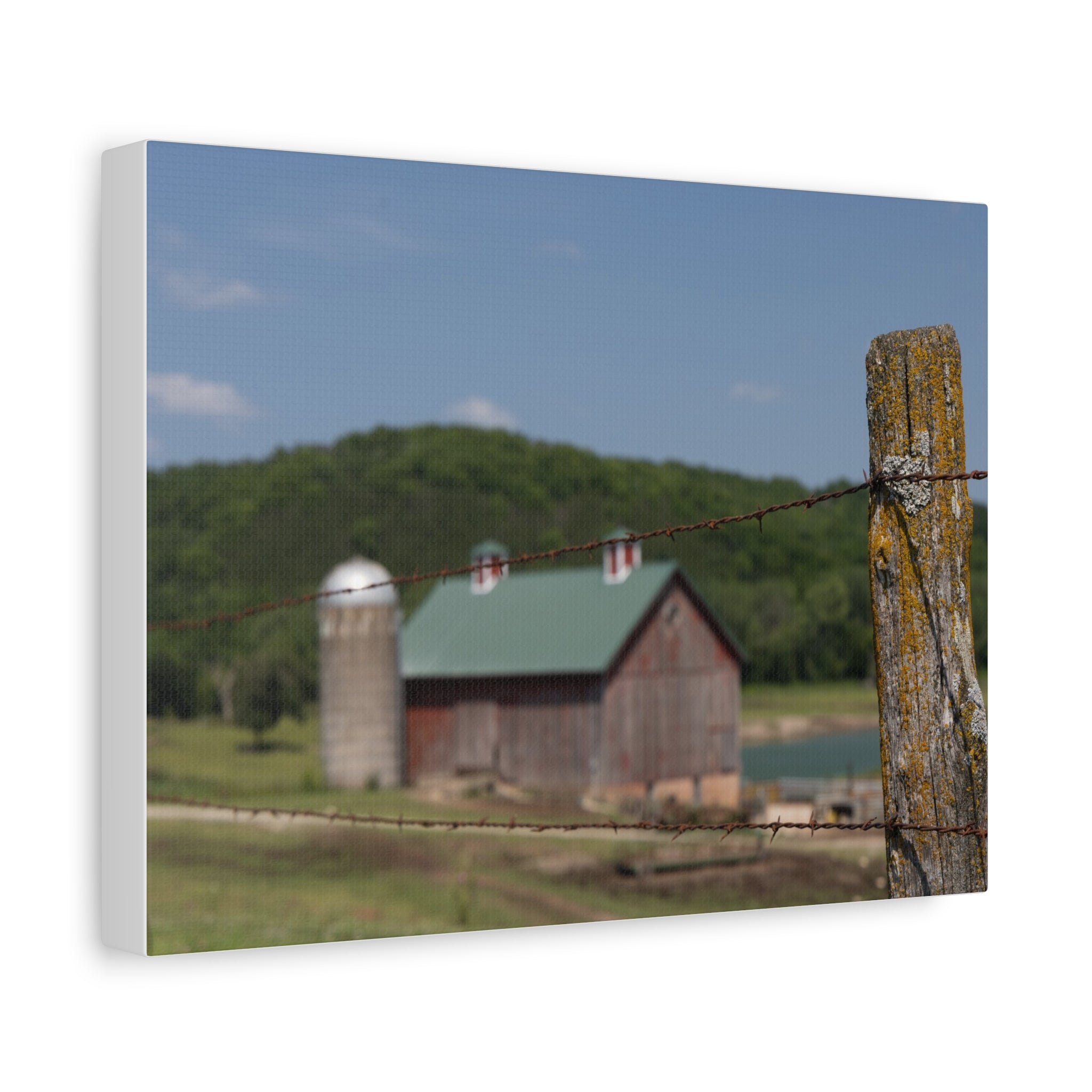 Rustic Barn Matte Stretched Canvas — Blurred Farm Landscape with Barbed Wire