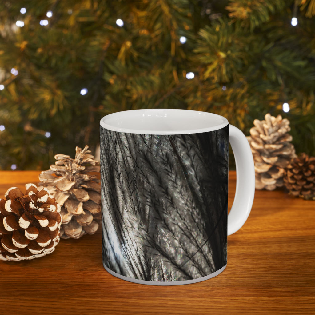 Ceramic mug with feather silhouette and soft neutral botanical design, 11oz or 15oz size, by Printify.